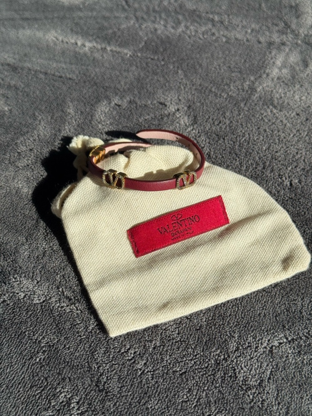Valentino Garavani Burgundy Leather Bracelet with Swarovski crystals.